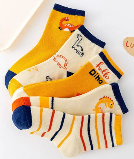 A set of yellow and orange socks with dinosaurs on them.